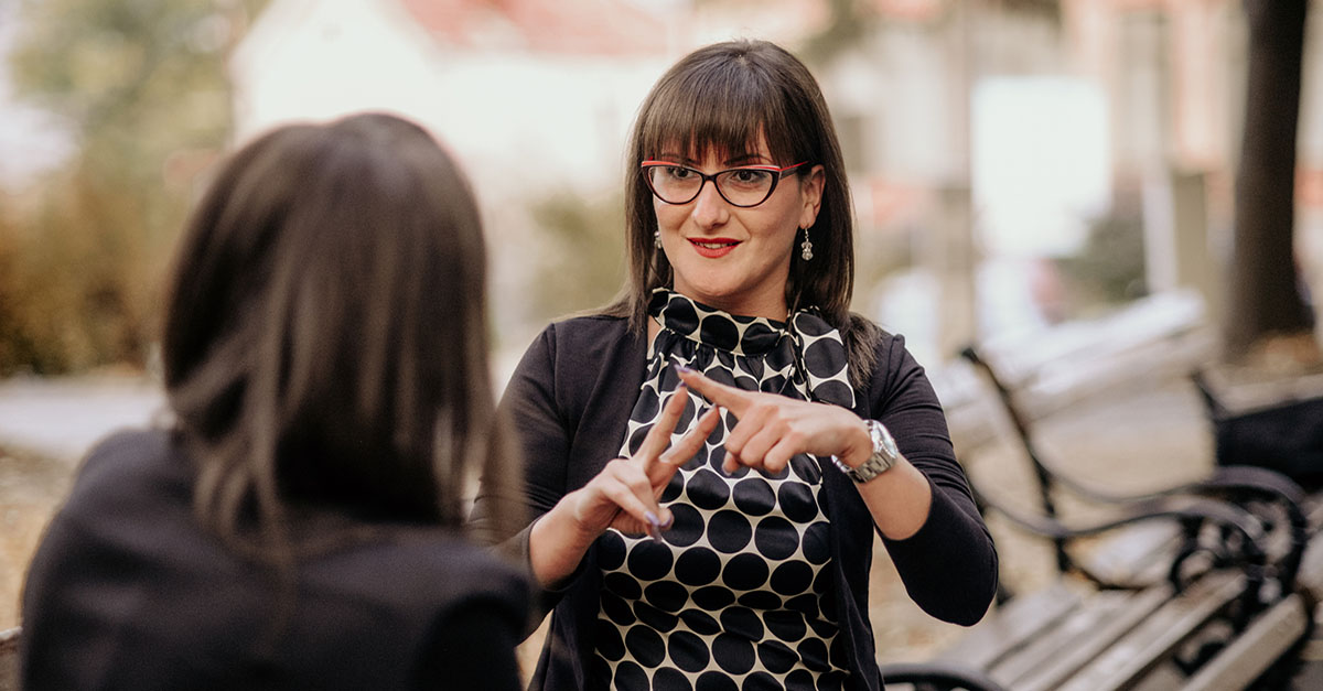 A woman communicating by using sign language